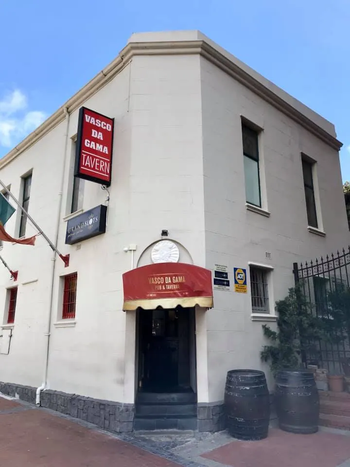 The Vasco da Gama Taverna building on the corner of Alfred Street, with its red awning