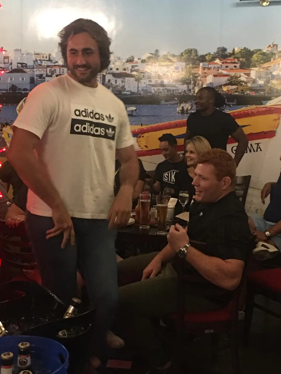 A guest in an Adidas shirt in the bar
